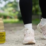 ayurvedic medicine bottles and persons feet