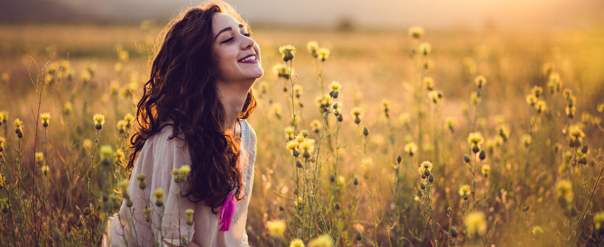 woman sitting in field