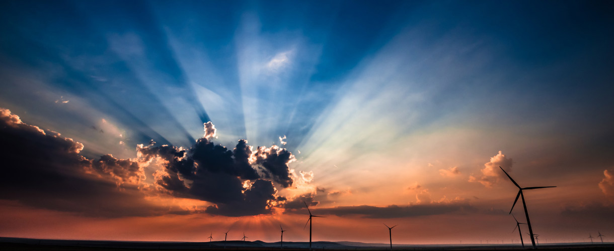 sun rays behind cloud