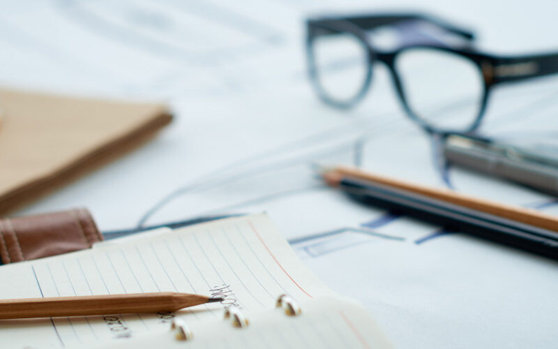 books pencils and glasses