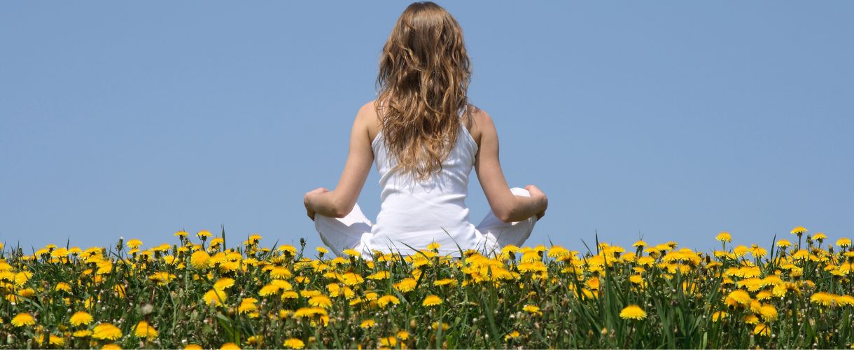 girl in a dandelion field