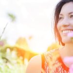 healthy happy woman in field of flowers