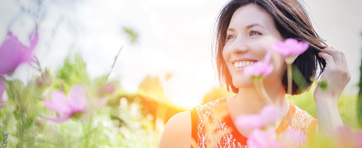 healthy happy woman in field of flowers