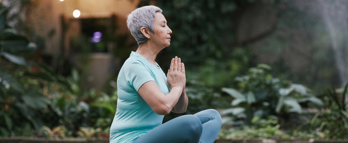 a middle aged woman meditating